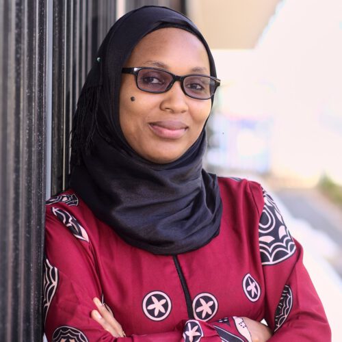 A Tanzanian woman wearing dark glasses.