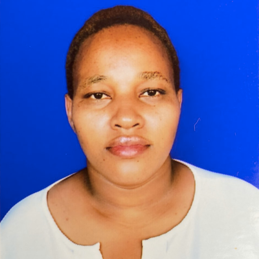 A Tanzanian woman wearing a white shirt.