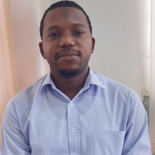 A Tanzanian man wearing a light blue shirt.