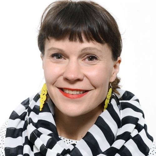 A finish woman with a black and white scarf