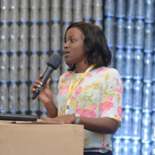 A Tanzanian woman giving a speech.